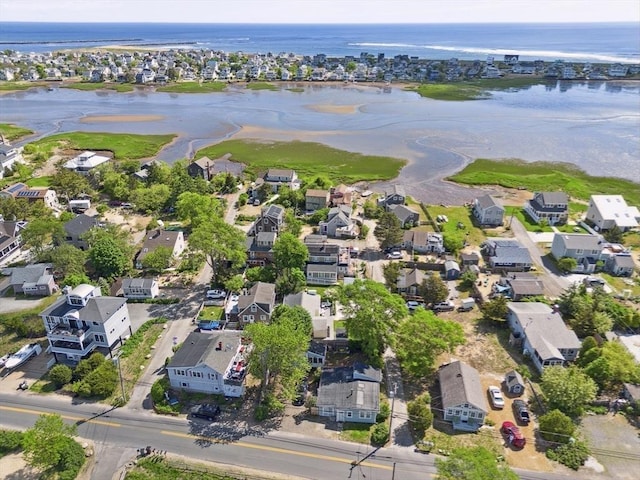 drone / aerial view with a water view and a residential view