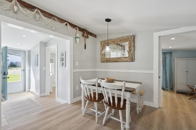 dining area with baseboards, recessed lighting, and wood finished floors