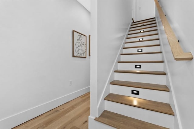 stairs with wood-type flooring