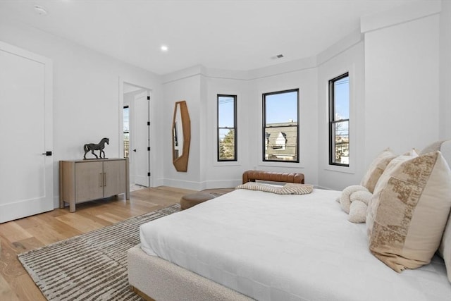 bedroom with light hardwood / wood-style floors