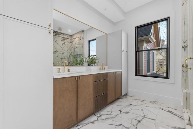 bathroom featuring an enclosed shower and vanity