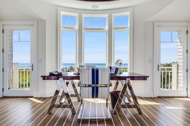 31 Moss Rd, Yarmouth, MA 02673 - dining area featuring hardwood / wood-style floors, baseboards, and plenty of natural light