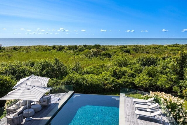31 Moss Rd, Yarmouth, MA 02673 - view of swimming pool with a deck with water view and an infinity pool