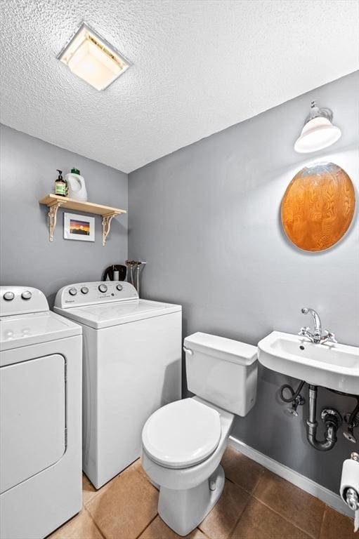13 Fillmore Rd Unit 15Ab, Salem, MA 01970 - half bathroom featuring independent washer and dryer, a textured ceiling, and tile patterned flooring