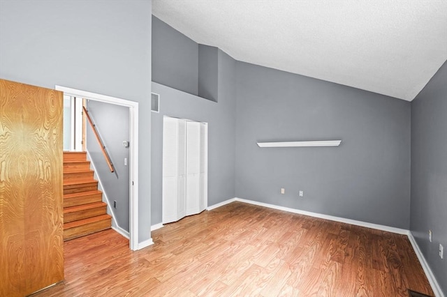 13 Fillmore Rd Unit 15Ab, Salem, MA 01970 - spare room featuring wood finished floors, stairway, and high vaulted ceiling