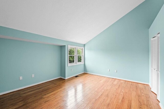 13 Fillmore Rd Unit 15Ab, Salem, MA 01970 - unfurnished bedroom with vaulted ceiling and light wood-style flooring