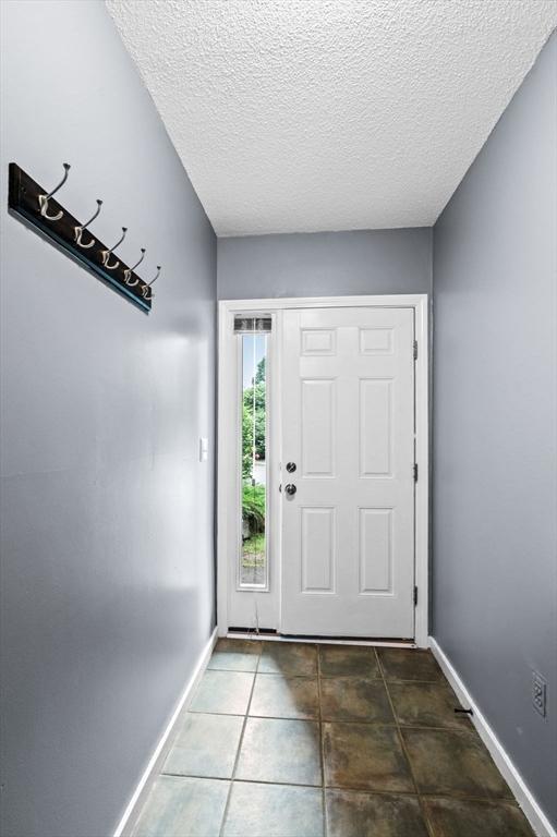 13 Fillmore Rd Unit 15Ab, Salem, MA 01970 - tiled entrance foyer featuring a textured ceiling