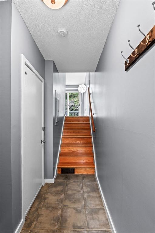 13 Fillmore Rd Unit 15Ab, Salem, MA 01970 - stairway featuring a textured ceiling