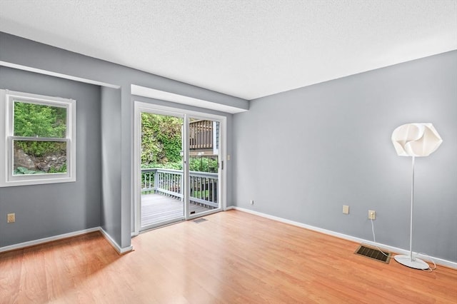 13 Fillmore Rd Unit 15Ab, Salem, MA 01970 - unfurnished room featuring light wood-type flooring and a textured ceiling