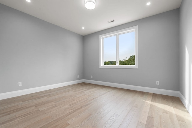 unfurnished room with light hardwood / wood-style floors