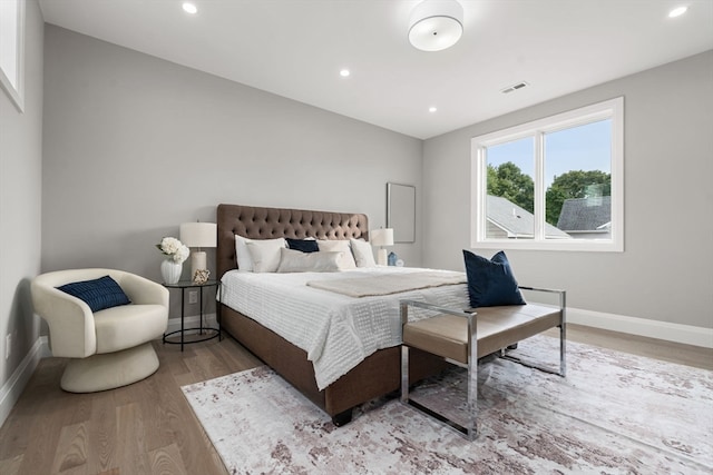 bedroom with hardwood / wood-style floors