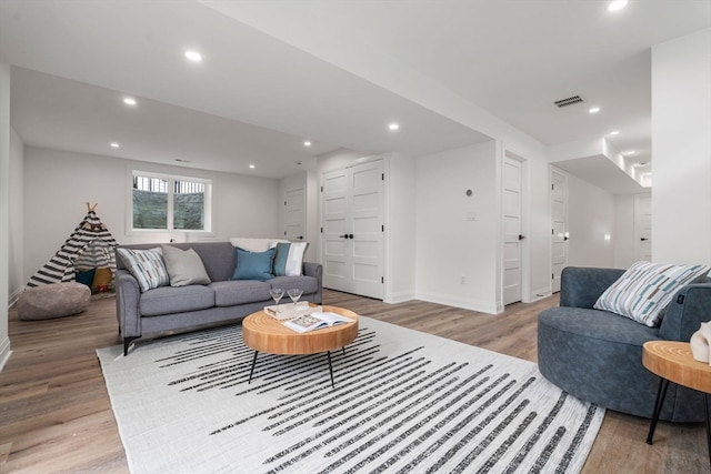 living room with light hardwood / wood-style floors