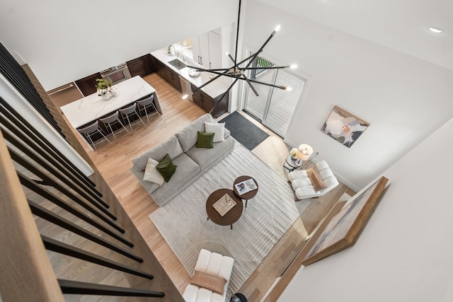 living room featuring a chandelier and wood-type flooring