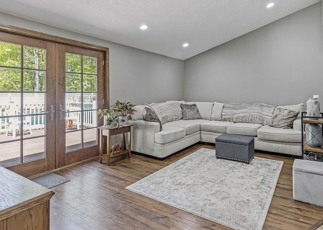 living area with dark wood-style flooring, french doors, and recessed lighting