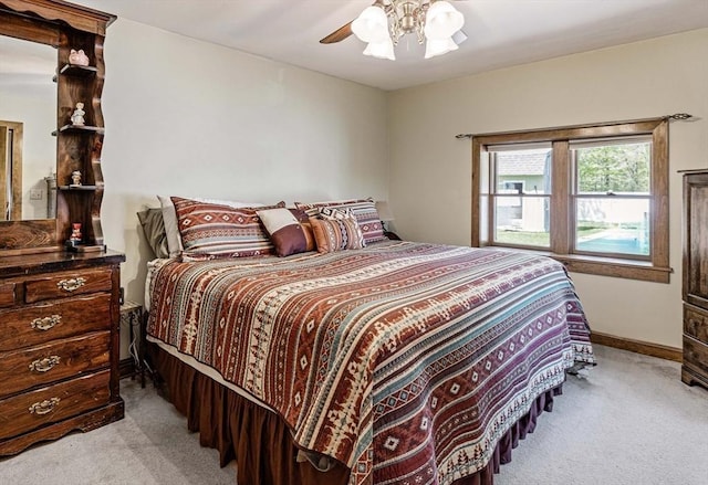 bedroom featuring baseboards, carpet flooring, and ceiling fan