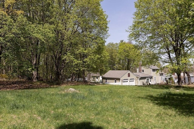 view of yard featuring a garage