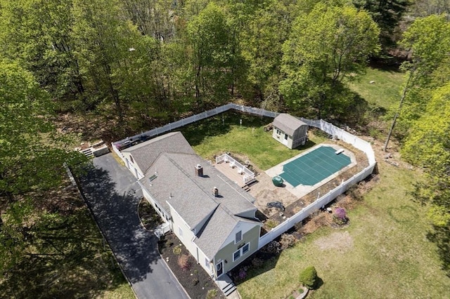 birds eye view of property with a wooded view