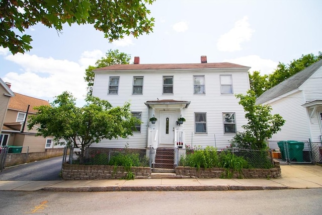 33 Cady St, Lowell, MA 01852 - colonial inspired home featuring a chimney