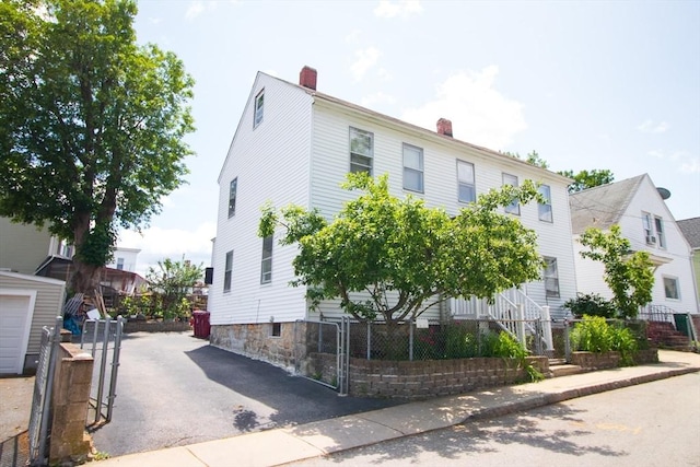 33 Cady St, Lowell, MA 01852 - view of front of home featuring a chimney