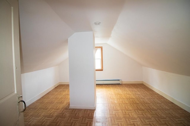 33 Cady St, Lowell, MA 01852 - bonus room with a baseboard radiator, lofted ceiling, and baseboards