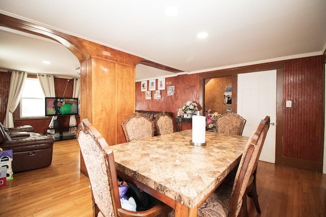 33 Cady St, Lowell, MA 01852 - dining room with wood walls, wood finished floors, and crown molding
