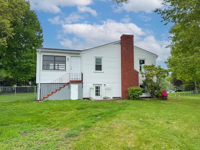 rear view of property with a chimney
