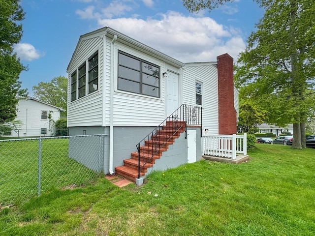view of front facade with a chimney
