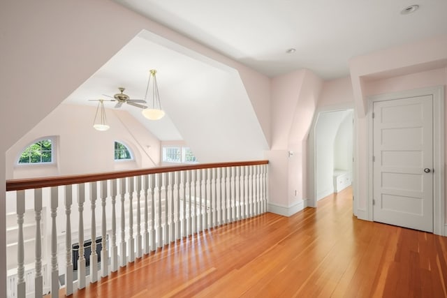 bonus room featuring ceiling fan, hardwood / wood-style flooring, and a wealth of natural light