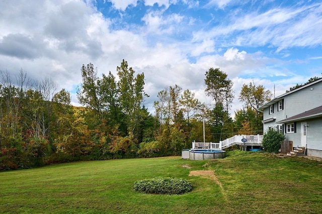 10 Phillips Dr, Colrain, MA 01340 - view of green lawn with an outdoor pool and a deck
