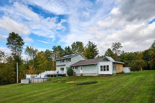 10 Phillips Dr, Colrain, MA 01340 - back of property with an outdoor pool, a lawn, and a deck