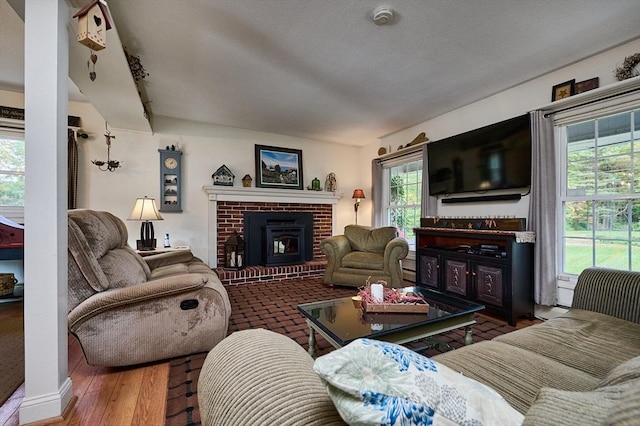 10 Phillips Dr, Colrain, MA 01340 - living area with a fireplace and wood finished floors