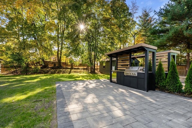 view of patio with a grill and exterior kitchen