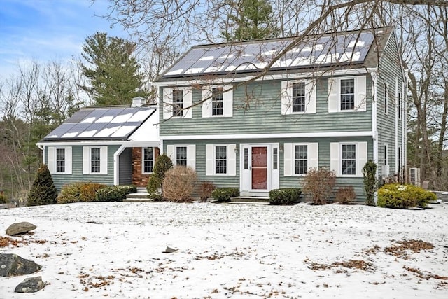 colonial house with solar panels