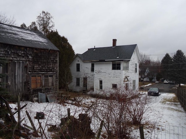 view of snow covered house