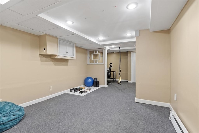 workout area with carpet and baseboard heating