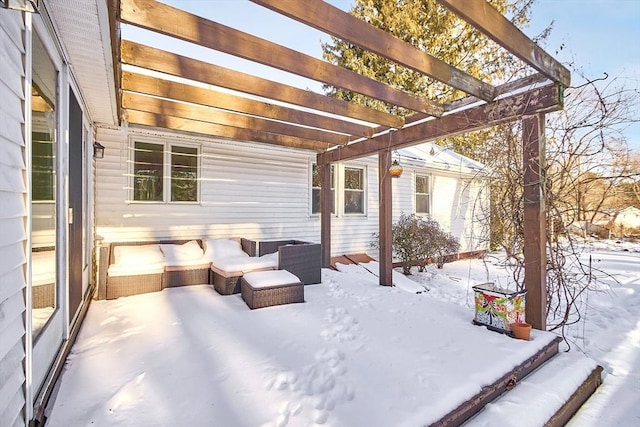 snow covered patio featuring a pergola