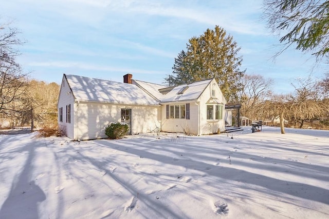 view of snow covered house