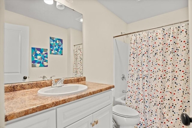 full bathroom featuring toilet, shower / tub combo, and vanity