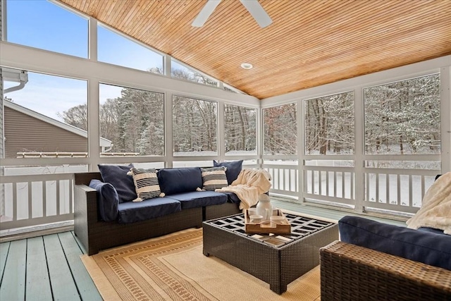 sunroom featuring lofted ceiling, wood ceiling, and ceiling fan