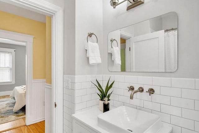 12 Highland Ave Unit A, Arlington, MA 02476 - ensuite bathroom with a wainscoted wall and wood finished floors
