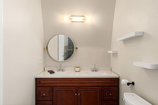 bathroom with toilet and vanity