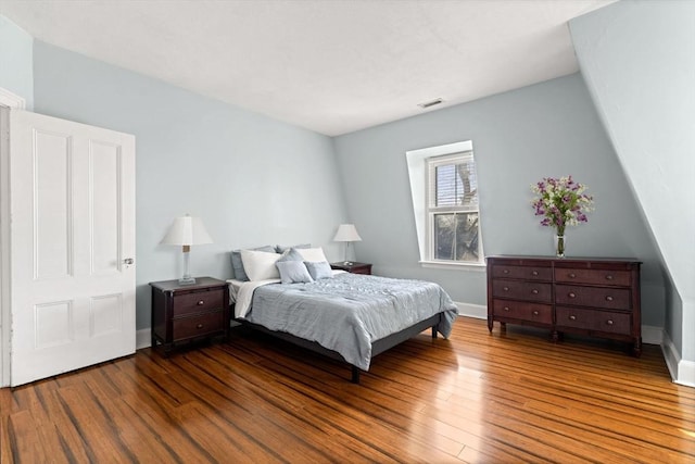 bedroom featuring dark hardwood / wood-style flooring