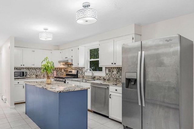 3 Sinclair St, Billerica, MA 01821 - kitchen with stainless steel appliances, a sink, tasteful backsplash, white cabinets, and light tile patterned floors