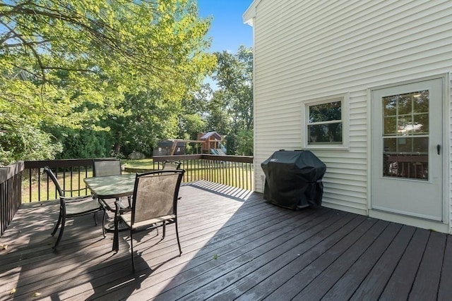 3 Sinclair St, Billerica, MA 01821 - wooden deck with area for grilling, outdoor dining area, and a playground