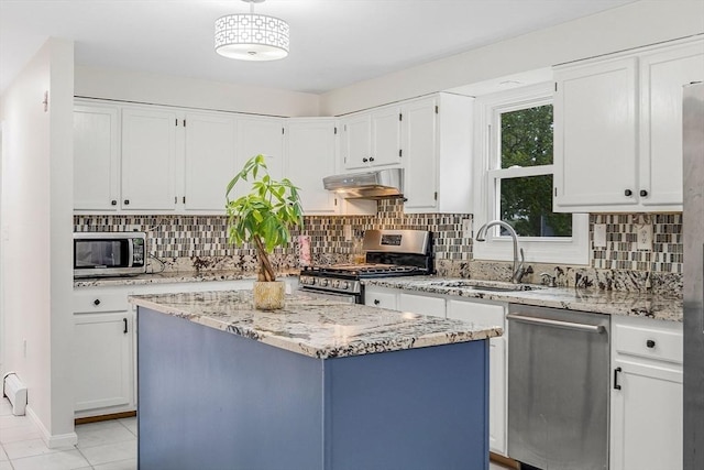 3 Sinclair St, Billerica, MA 01821 - kitchen featuring appliances with stainless steel finishes, a sink, under cabinet range hood, and white cabinetry