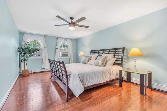 3 Sinclair St, Billerica, MA 01821 - bedroom with baseboard heating, wood finished floors, baseboards, and ceiling fan