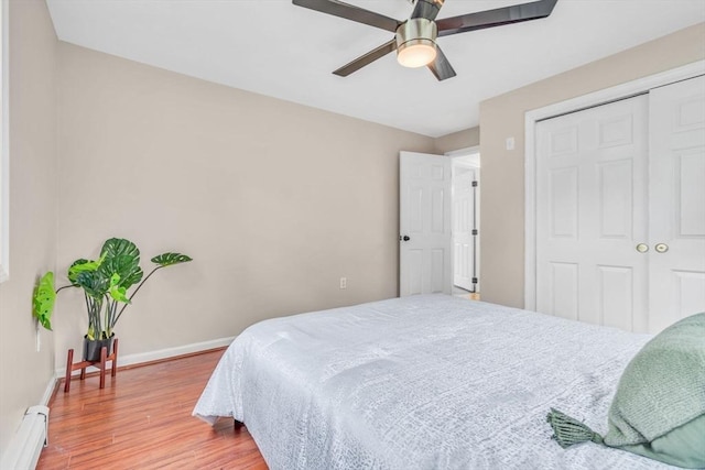 3 Sinclair St, Billerica, MA 01821 - bedroom featuring a baseboard heating unit, wood finished floors, baseboards, a closet, and ceiling fan