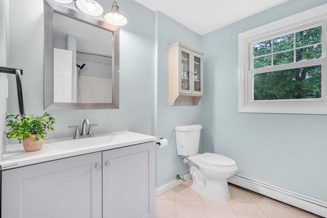 3 Sinclair St, Billerica, MA 01821 - bathroom with a baseboard heating unit, vanity, baseboards, tile patterned floors, and toilet