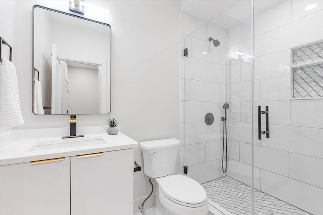 bathroom featuring walk in shower, vanity, and toilet