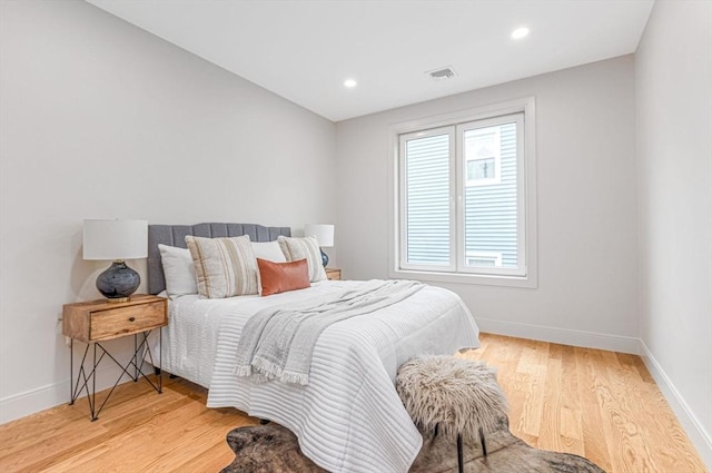 bedroom with light hardwood / wood-style floors